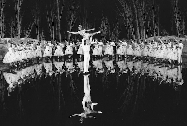 Three time olympic champion Sonja Henie performing on portable ice skating surface on stage in theater